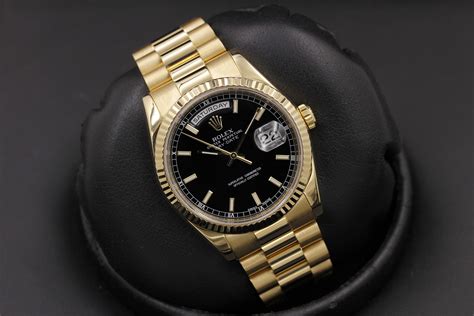 rolex day date black face.